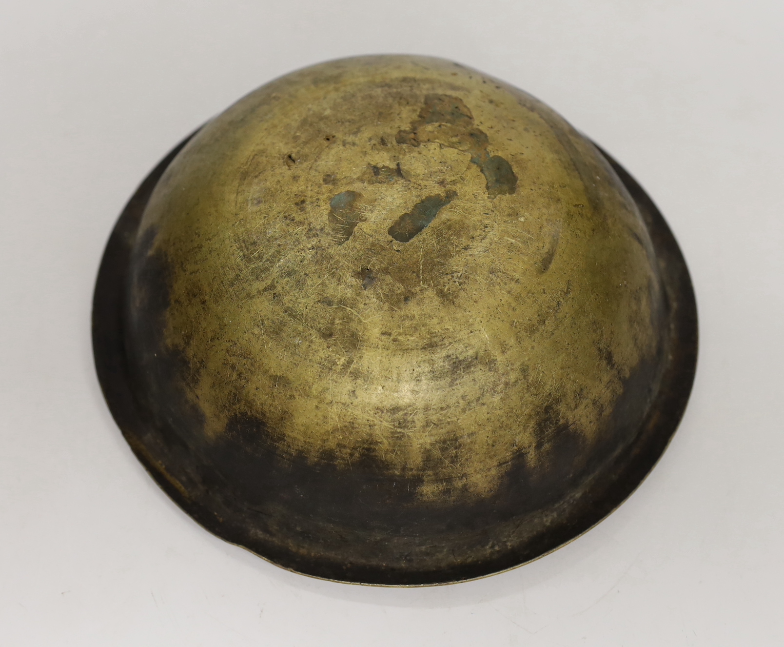 A Tibetan brass singing bowl, Lishui pattern, 23cm diameter